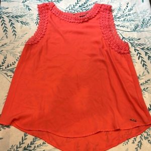 Small tank top. Coral color. Barely worn. No flaws.